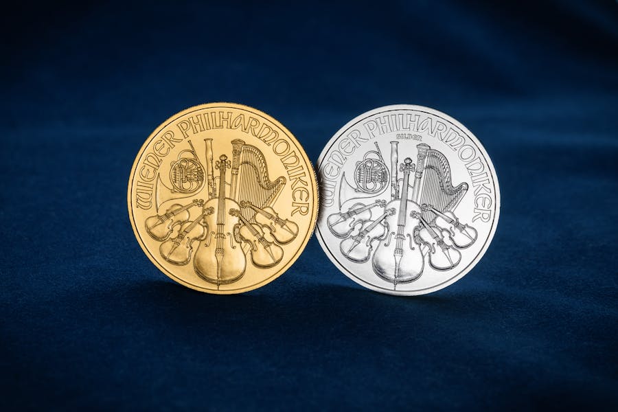 Gold and silver bullion coins on velvet